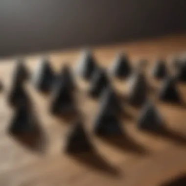 A collection of black obsidian pyramids displayed on a natural wooden surface, highlighting their unique shapes and textures