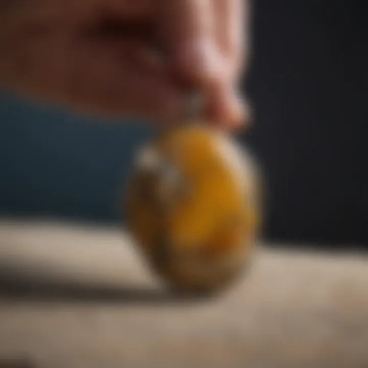 Artisan crafting a bumble bee jasper pendant highlighting the intricate jewelry-making process