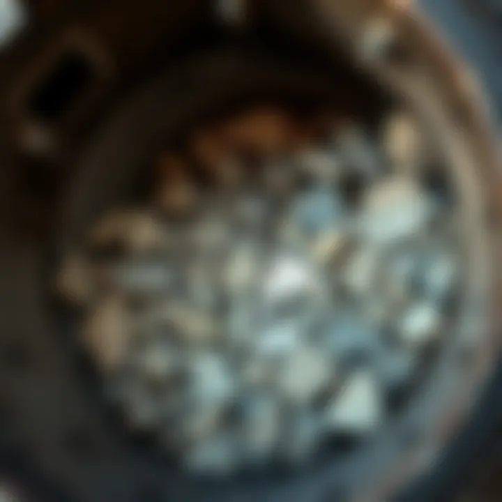 Inside view of a drum rotary rock tumbler filled with rough stones ready for tumbling.