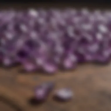 An artistic arrangement of raw and polished amethyst stones displayed on a wooden surface.