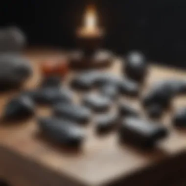 Ancient tools crafted from black obsidian displayed on a wooden table