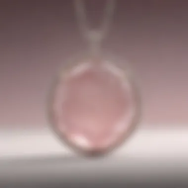 An elegant rose quartz pendant showcasing its soft pink hue.