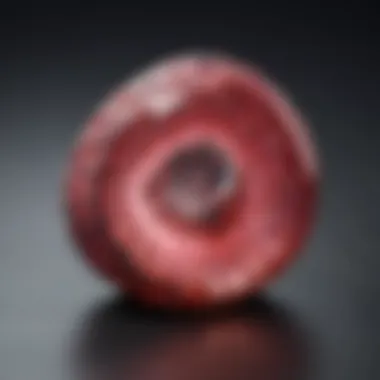 Rhodochrosite: The Gem of Compassion A beautifully polished rhodochrosite stone with intricate patterns