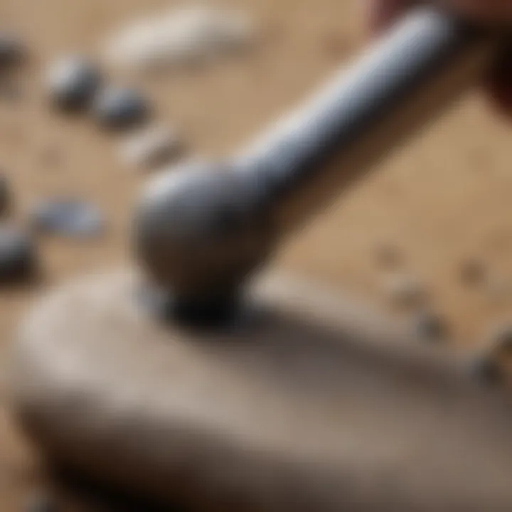 Close-up of a pebble being polished with a rotary tool