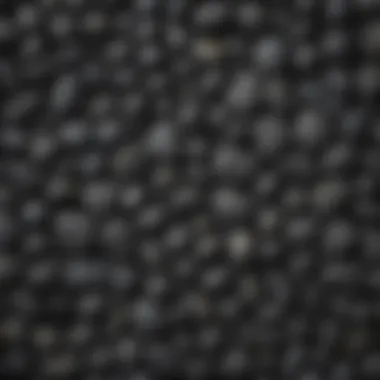 Diverse Textures of Small Black Stones Close-up of various small black stones showcasing their texture and patterns
